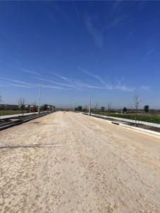 Transportation Way. The crushed limestone base is finish graded and the project is ready for Prime coat and 6” of asphalt.